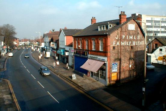 Cheadel Hulme high street shops from the station platform (1999)