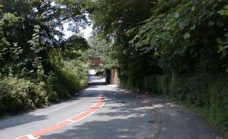 Hulme Hall Road looking North under the railway bridge